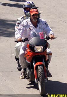 Coulthard taken back to the pits after he retired