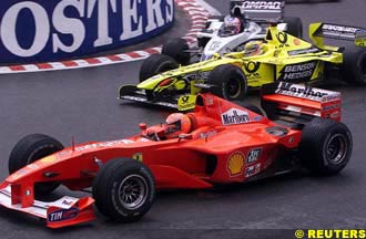 Schumacher overtakes Trulli at La Source
