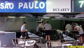 McLaren mechanics get the pit ready