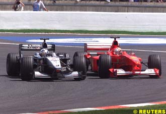 Coulthard gets past Michael Schumacher