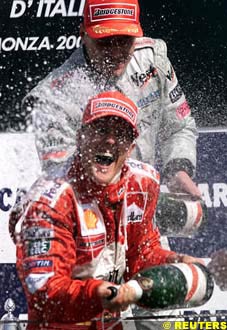 Class act: Hakkinen rejoices with Schumacher