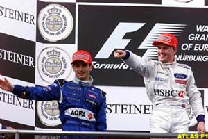 Jarno Trulli joining Johnny Herbert on the 1999 European GP podium