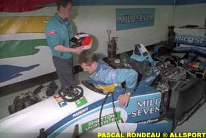 Michael Schumacher getting his seat fitted in the Benetton B195 during testing at Jerez, 1995