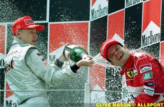 Hakkinen and Barrichello in the champagne bath