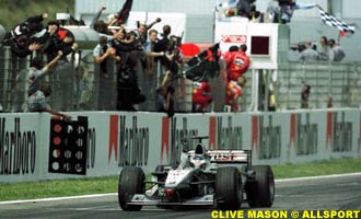 Hakkinen crosses the finish line