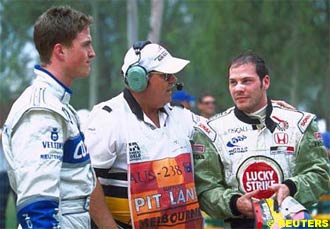 Ralf Schumacher and Jacques Villeneuve converse immediately after they crashed out of the 2001 Australian GP