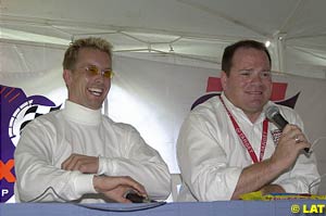 Kenny Brack with his future boss Chip Ganassi announcing their 2002 plans