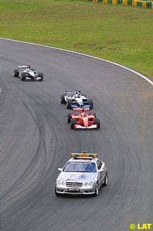 The safety car leads Schumacher, Montoya and Coulthard