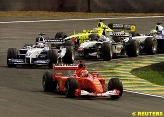 Schumacher leads the pack at turn one