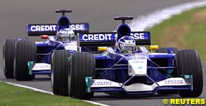 Nick Heidfeld following Kimi Raikkonen at the 2001 British GP