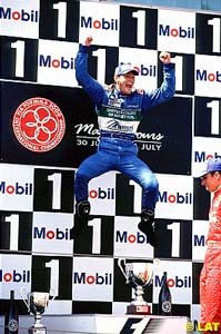 Mark Webber jumps for joy at Magny-Cours