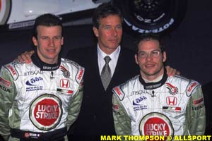 BAR teammates Olivier Panis and Jacques Villeneuve, with BAR boss Pollock standing behind them