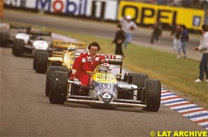 Nelson Piquet takes Prost back to the pits after winning the race, 1987