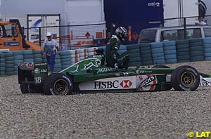 Eddie Irvine in the gravel at turn 1