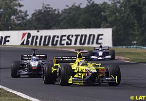 Jarno Trulli leads Mika Hakkinen  