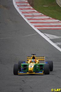 Winner Ricardo Sperafico is drowned in champagne by 2001 Formula 3000 champion Justin Wilson
