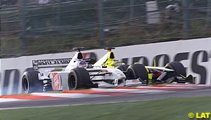 Villeneuve dives down the inside of Trulli