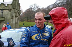 2001 World Rally Champion Richard Burns is congratulated by his father after completing the final stage