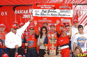 Jeff Gordon, with his wife and crew, receives a big cheque for winning the Winston Cup