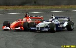 Montoya overtakes Schumacher for the lead