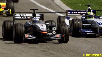David Coulthard, McLaren, about to be overtaken by Ralf Schumacher, Williams