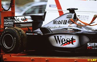 Hakkinen's car toed back to the pits