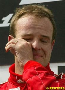 Rubens Barrichello cries on the podium