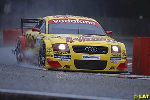 Spray and sparks fly from winner Aiello's Audi