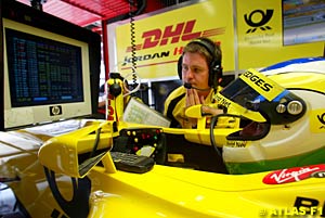 Fisichella sitting in his car in the garage