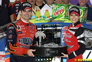 Winner Jeff Gordon with his trophy and a Miss Winston
