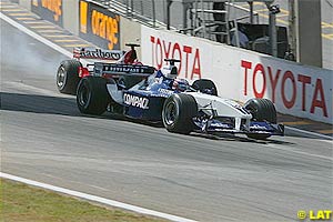 Schumacher tries to pass Montoya at the start