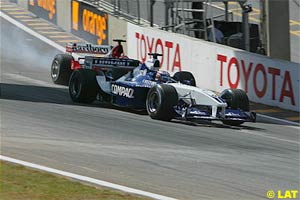 Montoya defends his position at the start of the race