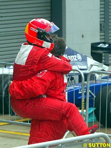 Michael Schumacher hugs Ross Brawn