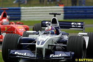 Juan Pablo Montoya chased by Schumacher