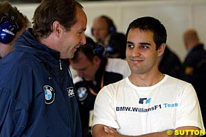 BMW's Gerhard Berger with Montoya at Silverstone