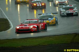 The Ferrari 550 Maranello of Andrea Piccini and Jean-Denis Deletraz leads the field in the wet conditions