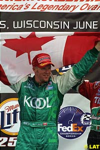 Winner Paul Tracy celebrates the win at Milwaukee with the Canadian flag
