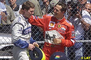 2001: Michael Schumacher congratulates race winner, brother Ralf
