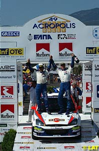 Colin McRae and Nicky Grist celebrate their Acropolis Rally win