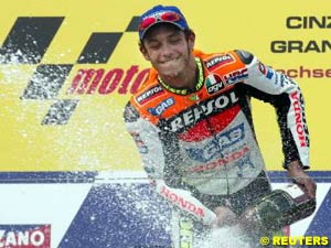 Valentino Rossi sprays champagne on the podium