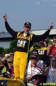 Ward Burton stands on the door sill after winning at New Hampshire