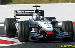 David Coulthard attacks a corner at Magny Cours