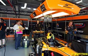 The Arrows garage in a rare moment of action