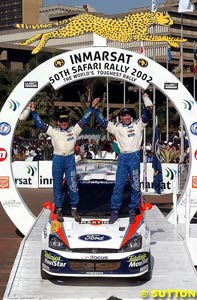 Nicky Grist and Colin McRae celebrate winning the Safari Rally