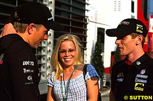 Davidson and his girlfriend talk to Kimi Raikkonen