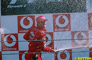 Rubens Barrichello sprays champagne at Monza