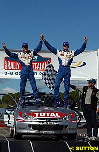 World Champion and Rally New Zealand winner Marcus Gronholm (right) celebrates with co-driver Timo Rautianen (left)