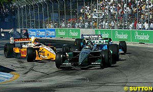Jimmy Vasser about to make contact with Paul Tracy