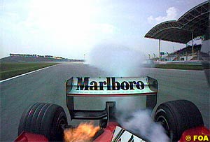 Rubens Barrichello's engine lets go