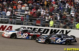 Johnny Benson just holds off Mark Martin for his first win